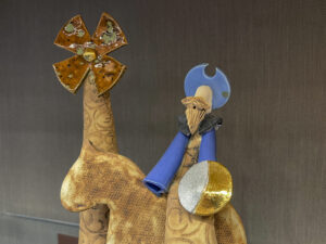 Ceramic sculpture of one of the three kings, his camel, and the star.